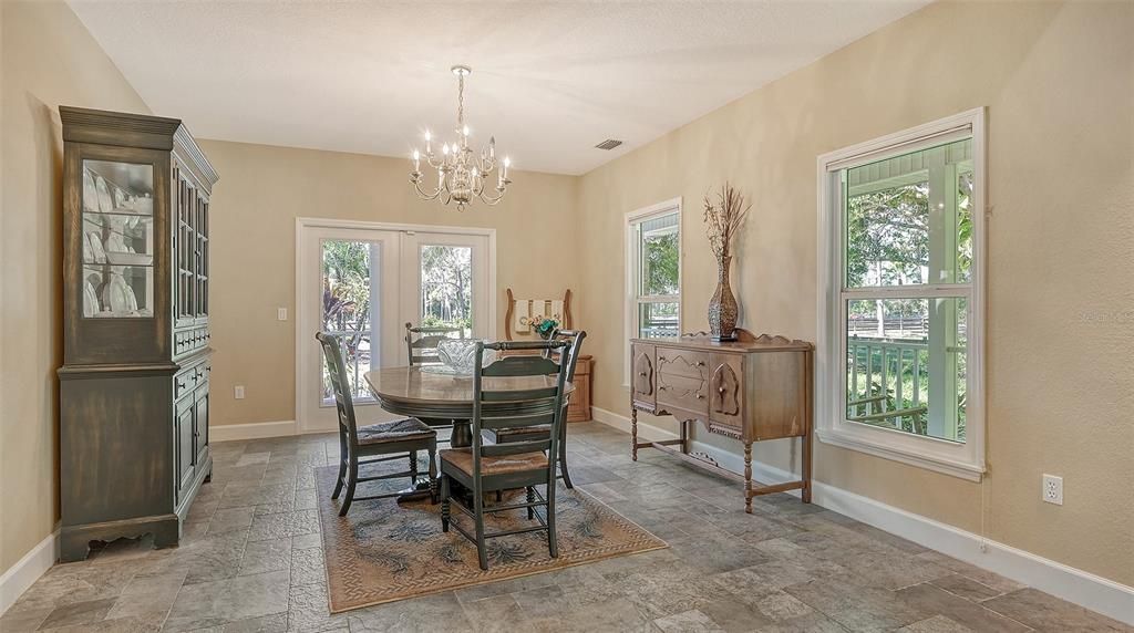 The formal dining room has French doors leading to the wrap around porch.