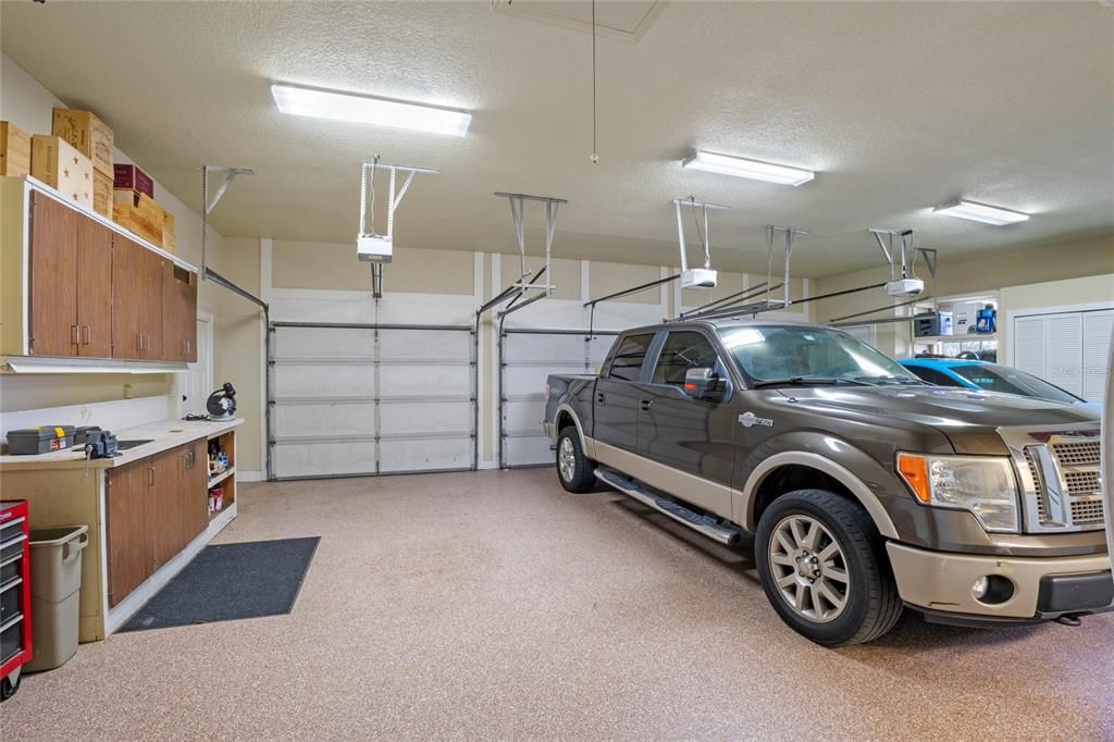 This garage is oversized to accommodate large vehicles and still provide space for gardening, workshop and storage.