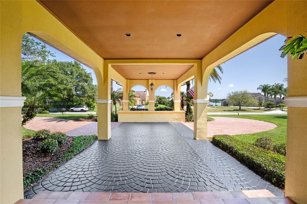 Porte Cochere with fountain and dramatic entrance