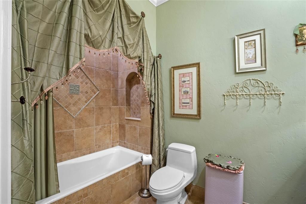 Custom shower curtain and high end fixtures make this bathroom suitable for royalty!