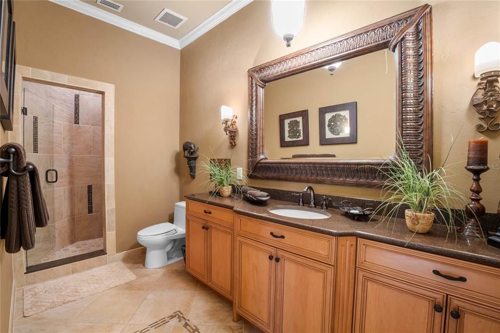Just one of the ensuite bathrooms - floor to ceiling shower tile, custom cabinets, granite and more!