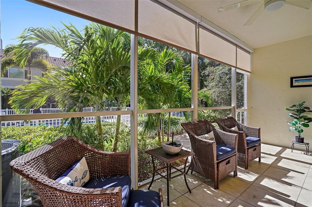 Large Screened in Lanai with lush tropical gardens and pool views.  Great for relaxing or entertaining