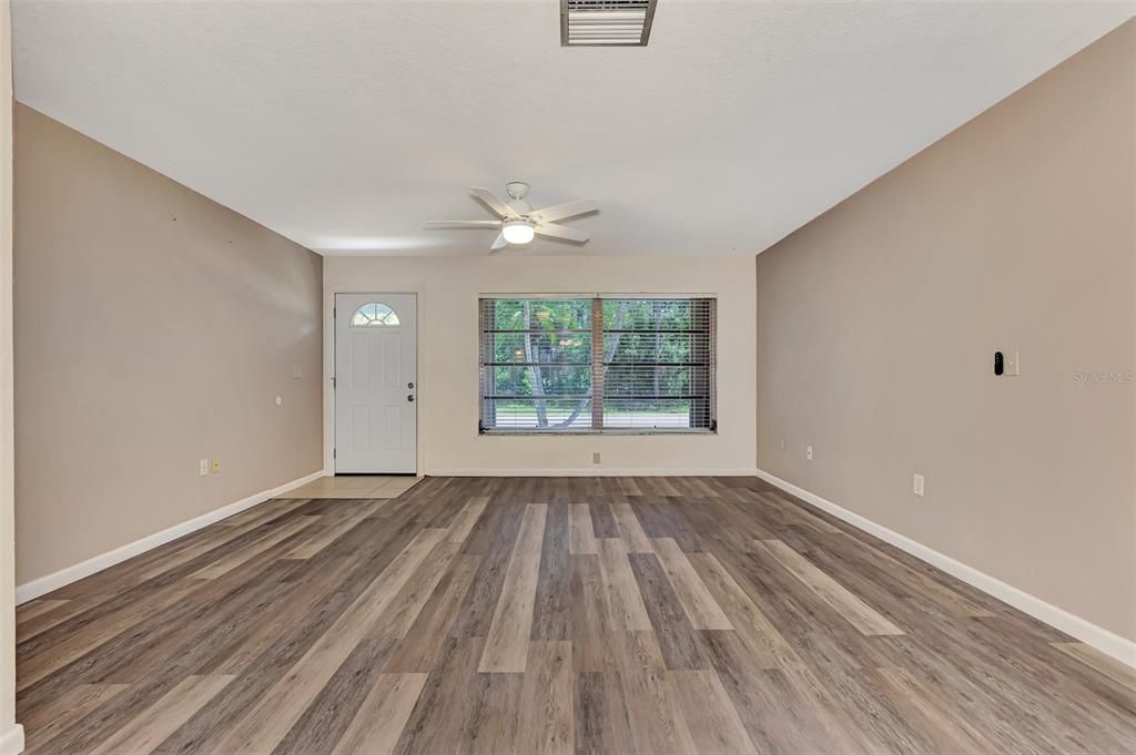 Nice space for living room, attractive flooring.