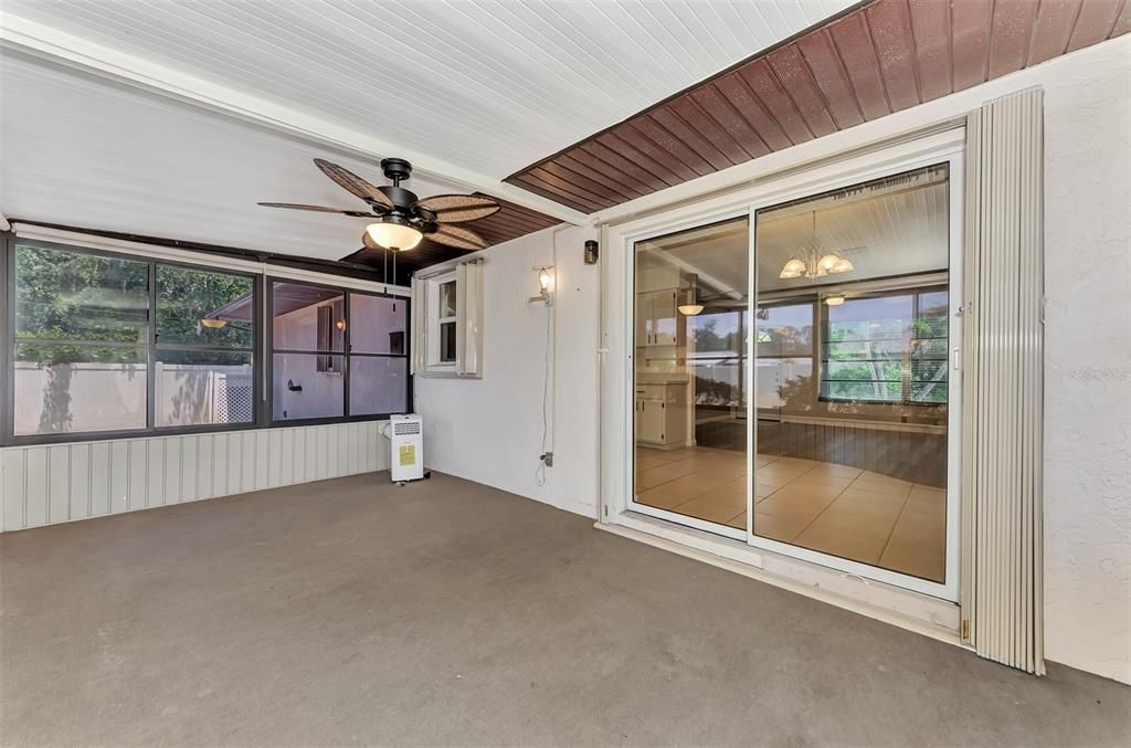All the windows have shades and the ceiling fan/light is new. Accordian Hurrican Shutters on the kitchen window and the newer sliding glass door(2022).