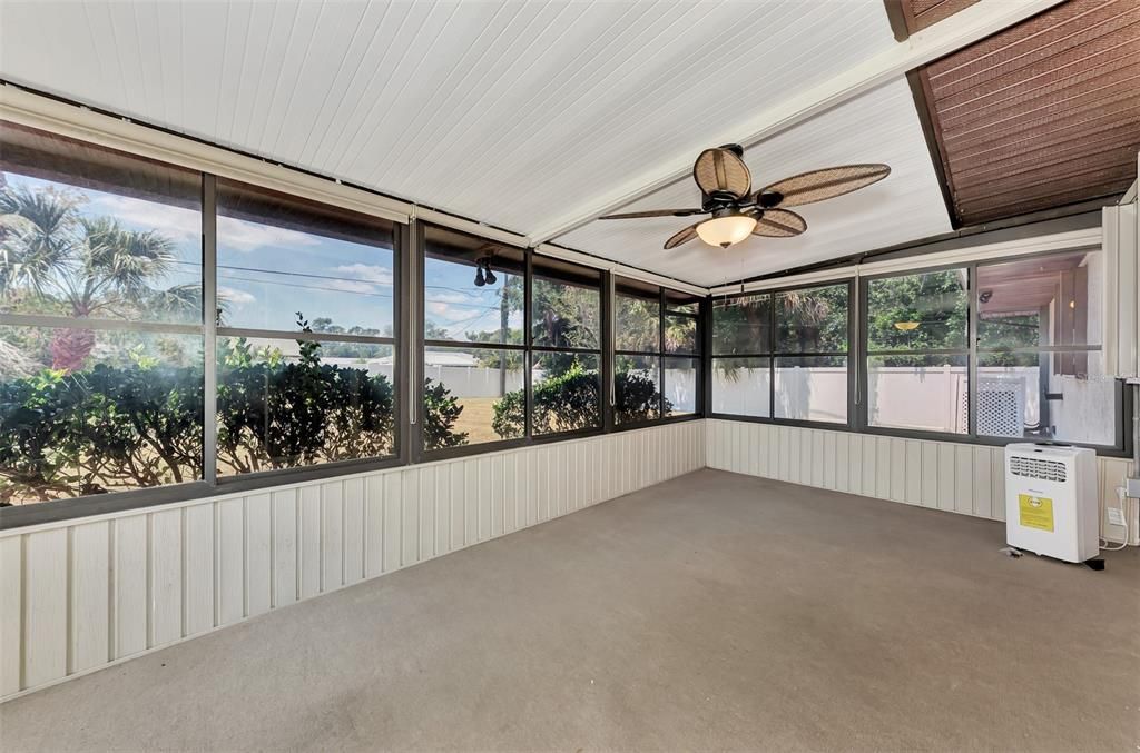 Enclosed and carpeted Florida Room. Windows are vinyl and can be opened to screening.