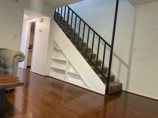 Built in shelving under stairs
