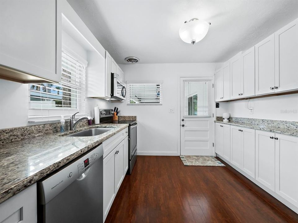 Stainless Steel appliances in the kitchen; note access to carport which can be converted to an enclosed garage or extension of the kitchen or living space