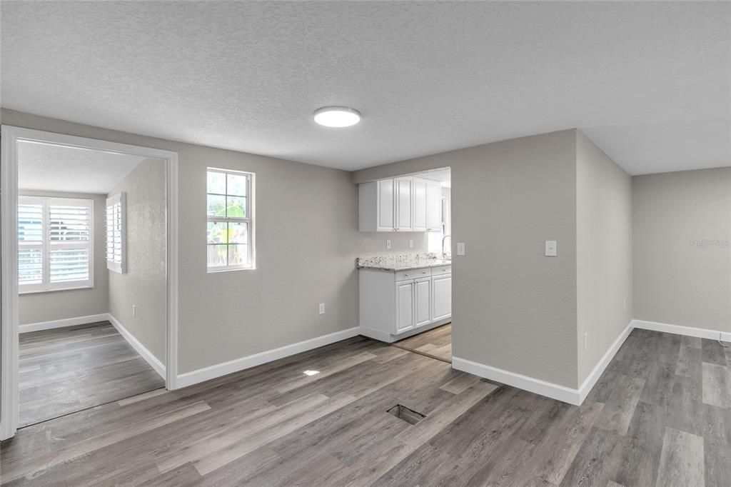 Dinning space looking into kitchen and bonus room/4th bedroom