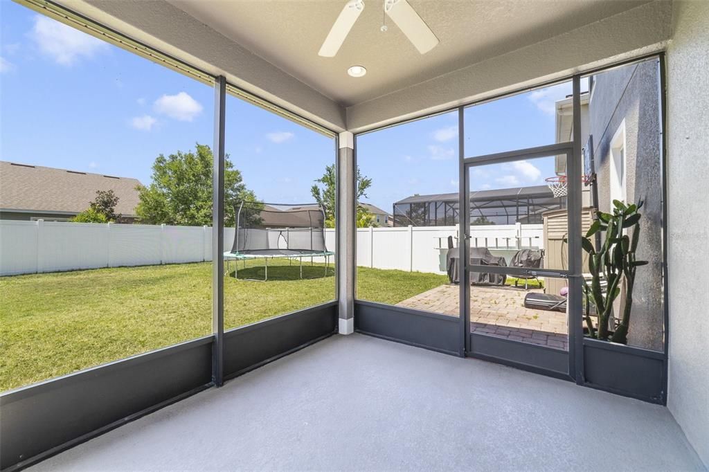 The screened lanai opens to an extended paver patio overlooking the fully fenced backyard - whether you want to relax in the shade or soak up the sun the choice is yours!