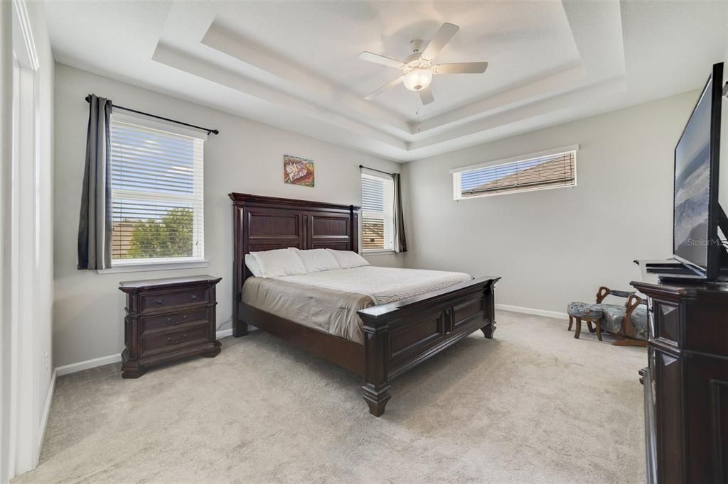 The comfortable layout of the second floor includes a generous PRIMARY SUITE under a lovely double tray ceiling, complete with a WALK-IN CLOSET and private en-suite bath.