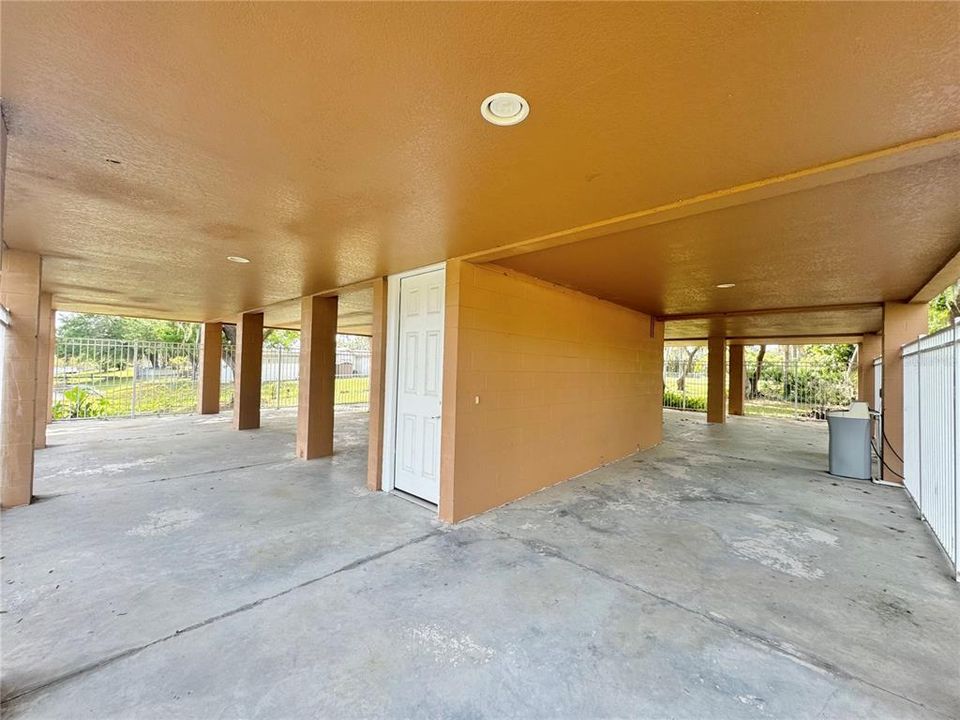 Carport, access to home upstairs & storage unit