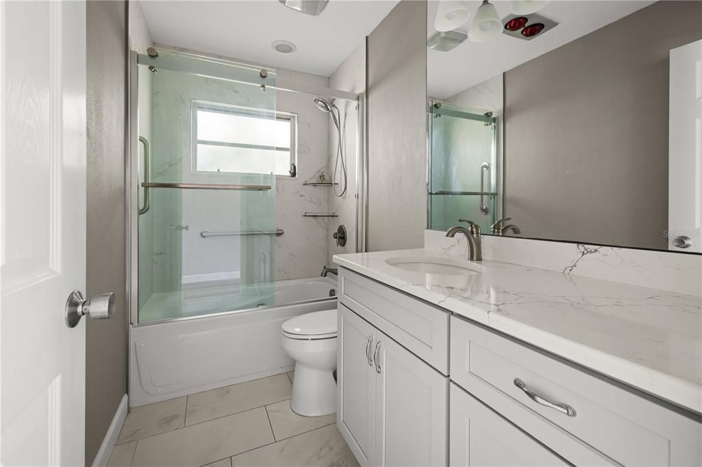 Each of the two bedrooms has access to the bathroom off of a private hallway, that is separate from the living area.