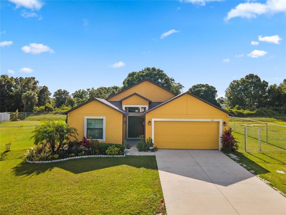 Welcome to Poinciana Villages and this beautiful BARELY LIVED IN HOME, built in 2019 on .28 ACRES with UPDATES throughout, TILE FLOORS in all main living areas and tons of AMENITIES!