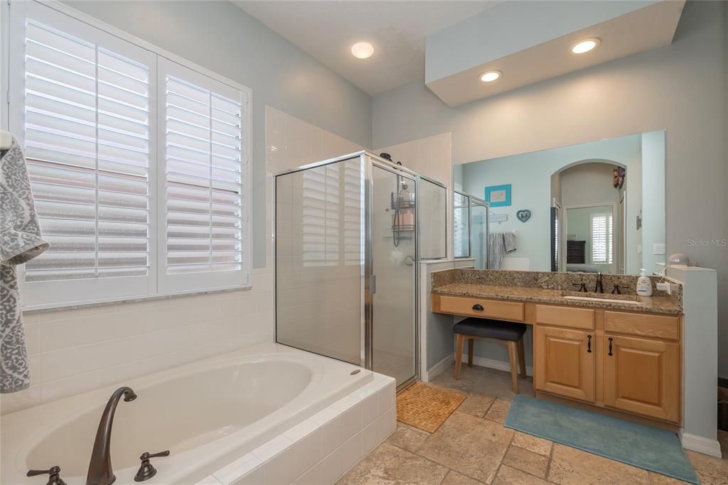 Soaking tub and separate walk in shower in the primary Bathroom