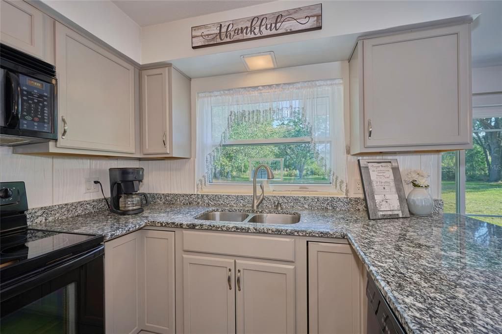 The kitchen has been renovated with lovely granite counter tops