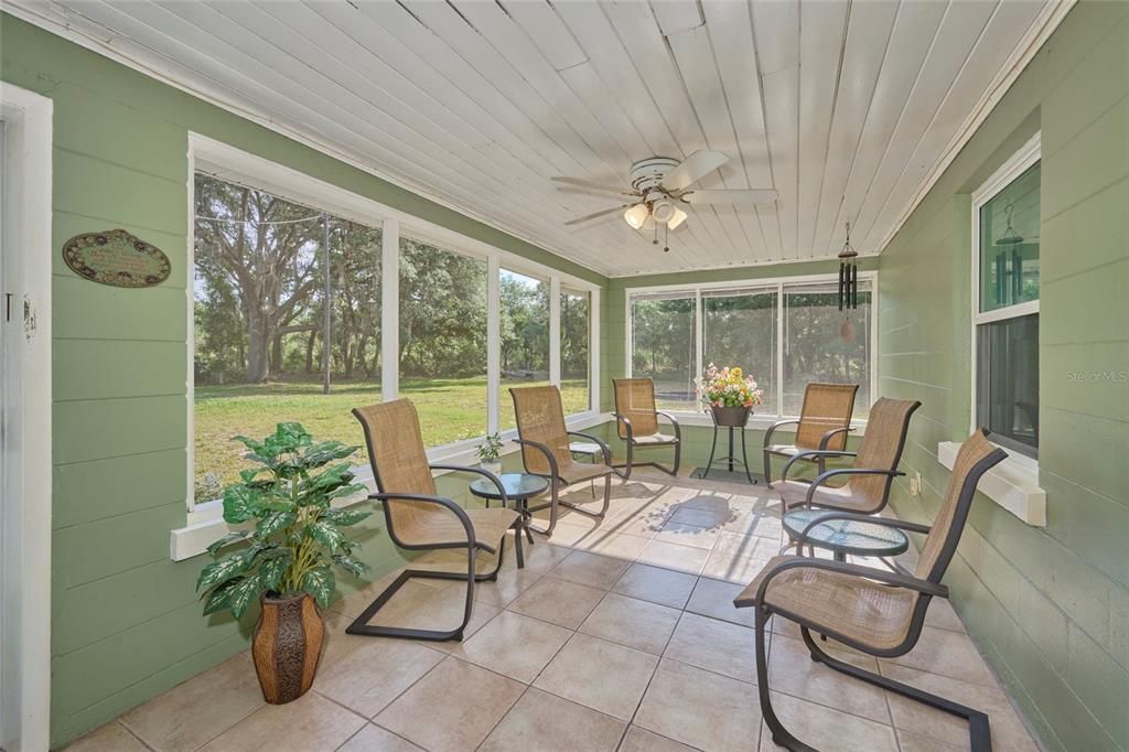 The sun room is located right off the dining area.  A great space to relax and reflect!