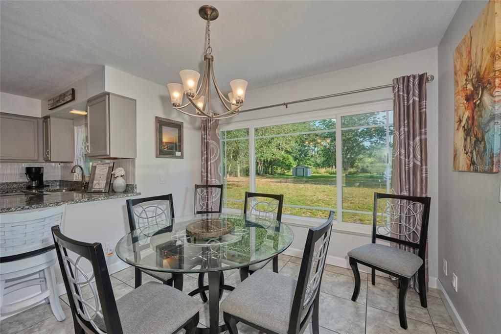 Dining area located off of the kitchen with another nice window to let in natural light!