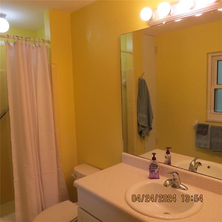 Guest bathroom with shower tub combo