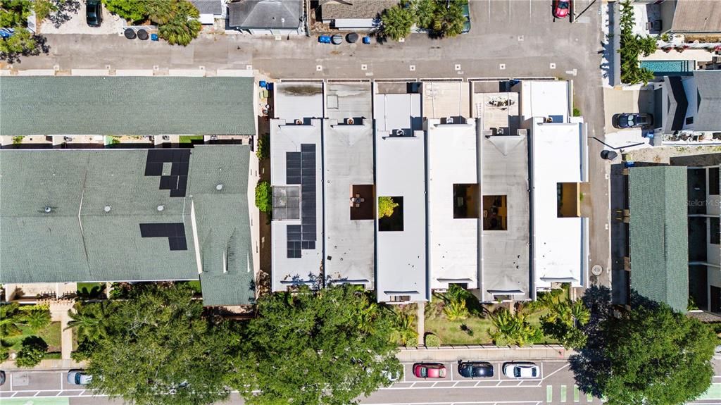 Aerial view showing the six units in the small complex with courtyards