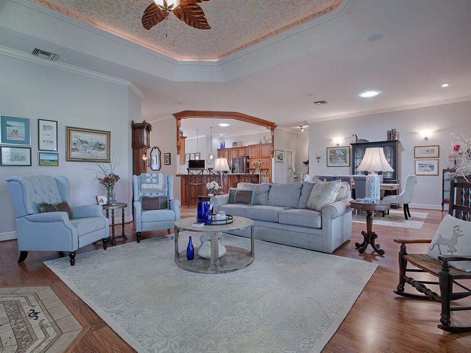 Great room with crown molding and tall ceilings