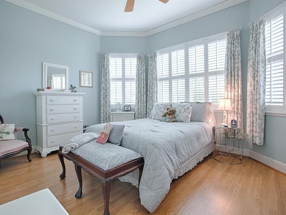 Inviting guest bedroom with a bay of windows