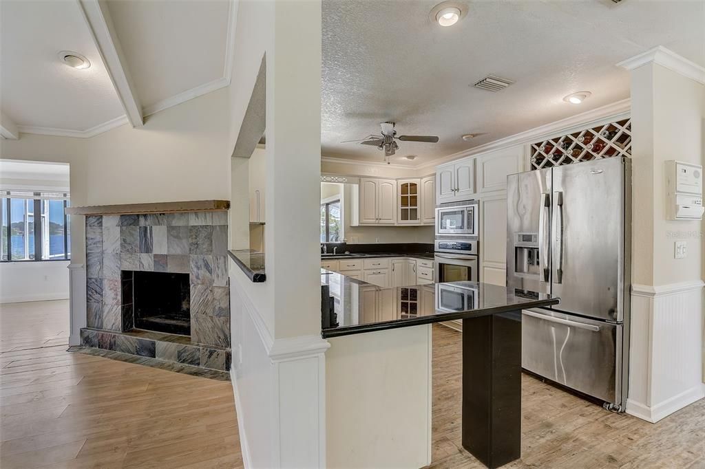 The living room flows into a spacious dining area off the well equipped kitchen where the home chef will enjoy granite countertops, stainless steel appliances and upgraded cabinetry.