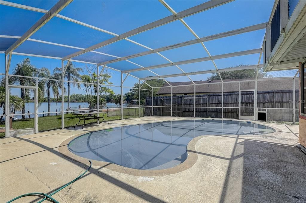 Screened pool with views of Lake Cane!