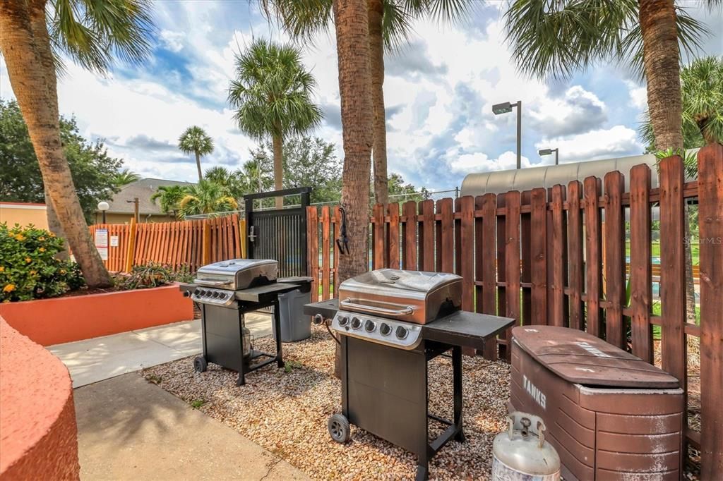 Outdoor grills by poolside for residents' use