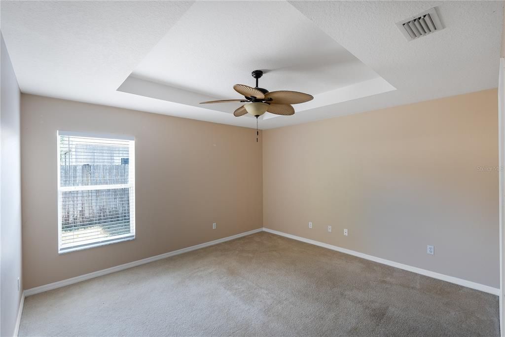 Primary Bedroom with ceiling fan