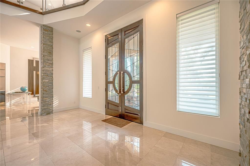 Welcome thru the 10 FOOT CUSTOM MAHOGANY Hand Cut Beveled Glass Doors and enter into the Living Room.