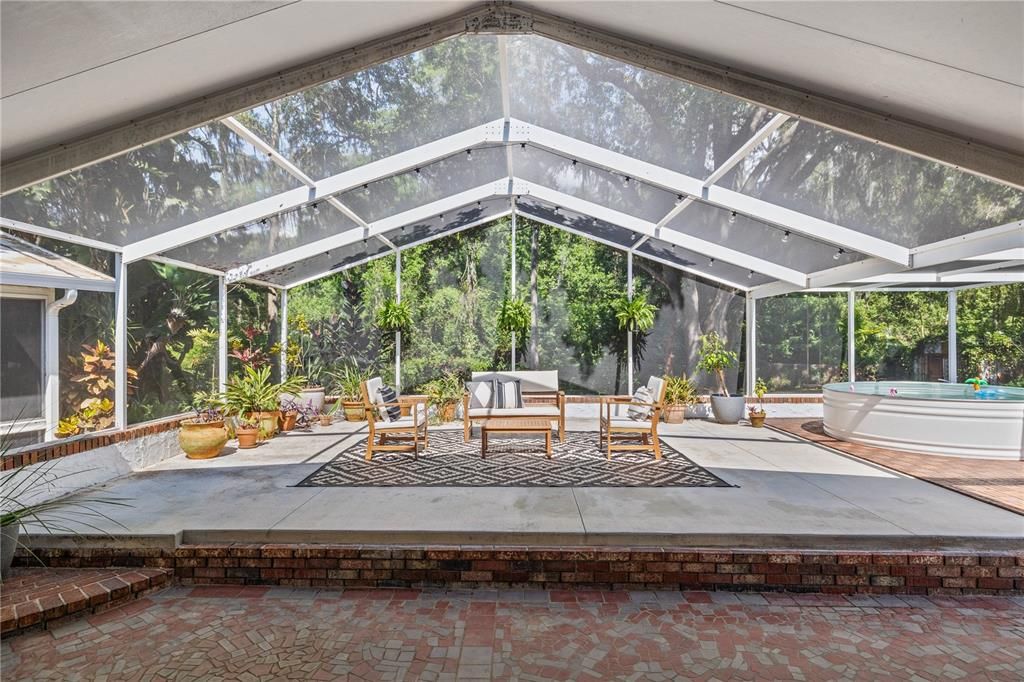 Welcome to your outdoor oasis. This patio is absolutely huge and overlooks nothing but serene trees and lush greenery.