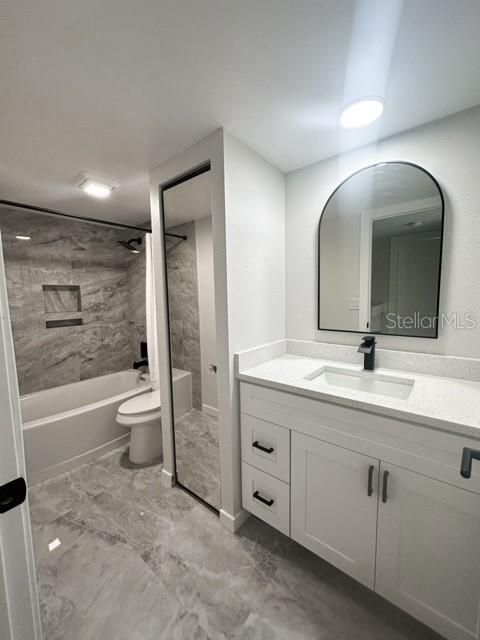 Another view of secondary bathroom-towel closet with mirror door