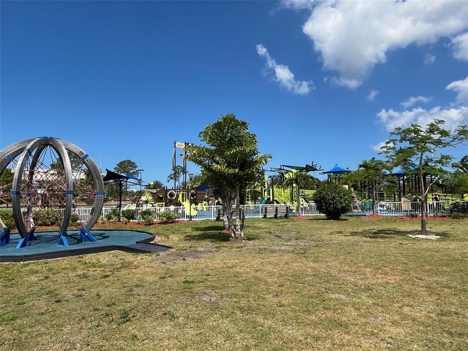 Massive Kids Play Area, flanked by OpenSpaces, Picnic Pavilinns, Exercise Spaces, and Bathroom Facilities