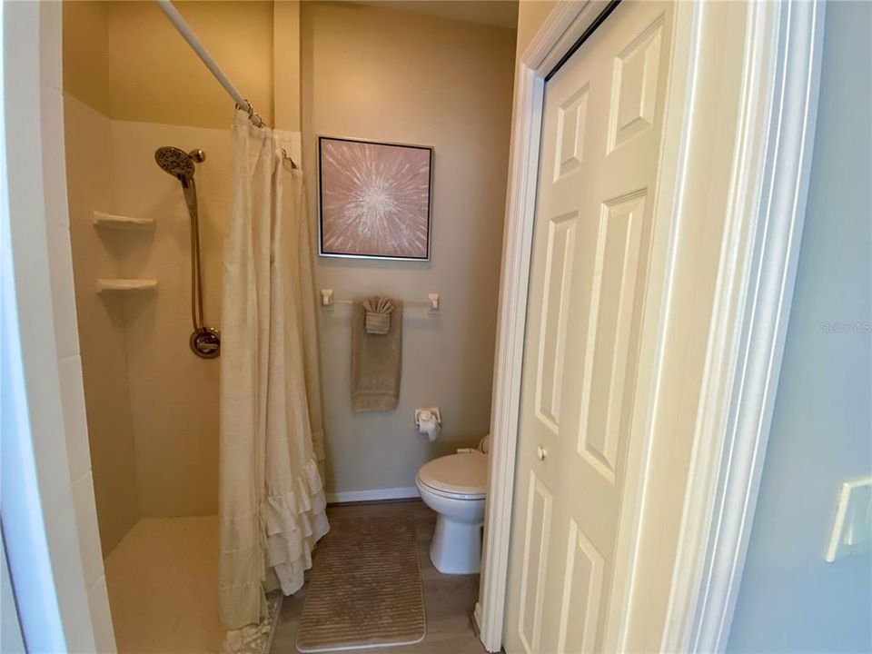 Large walk in shower and linen closet