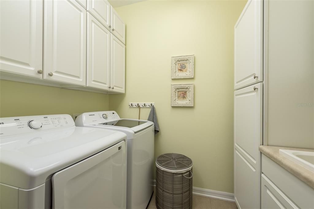 laundry room with sink and wonderful built in cabinets