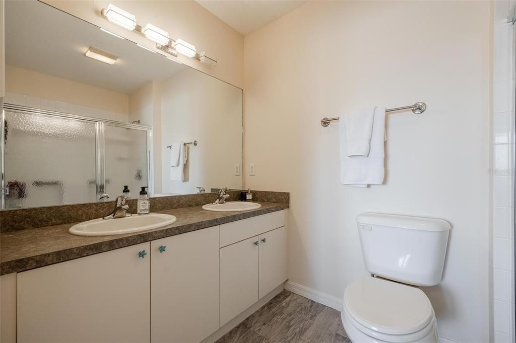 Ensuite Bathroom has bonus dual sink vanity and walk - in shower.