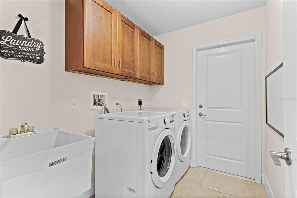 Indoor Laundry with washer and dryer and storage