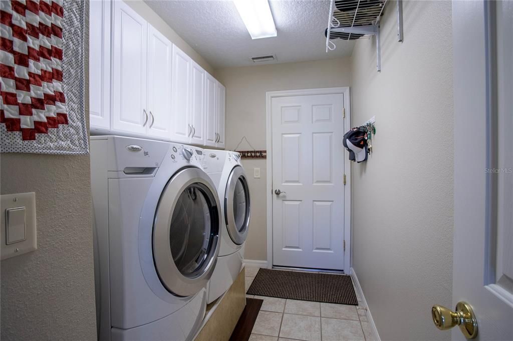 Laundry Room and Garage access.  Garage has been expanded in length and will accommodate larger vehicle parking.