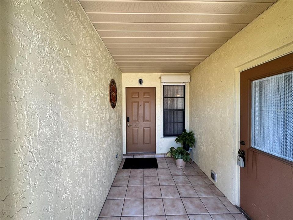 Entryway and exterior entry to laundry and garage