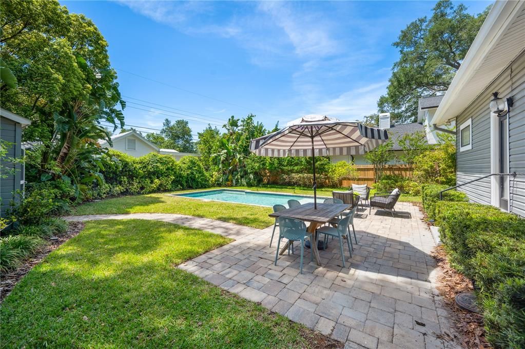 Backyard experience! Heated salt-water pool with paver patio and built-in natural gas grill!