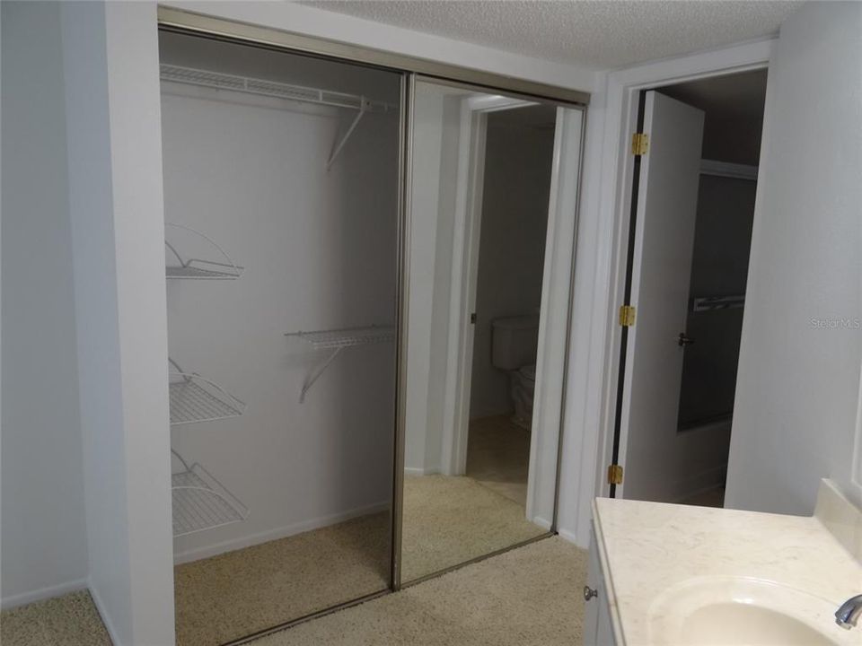 HIS AND HER BI FOLD CLOSETS WITH MIRRORS