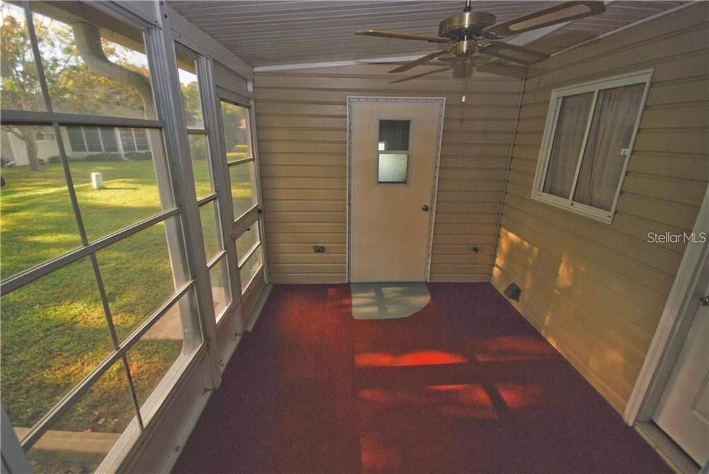 Sunroom and door that leads to STORAGE ROOM