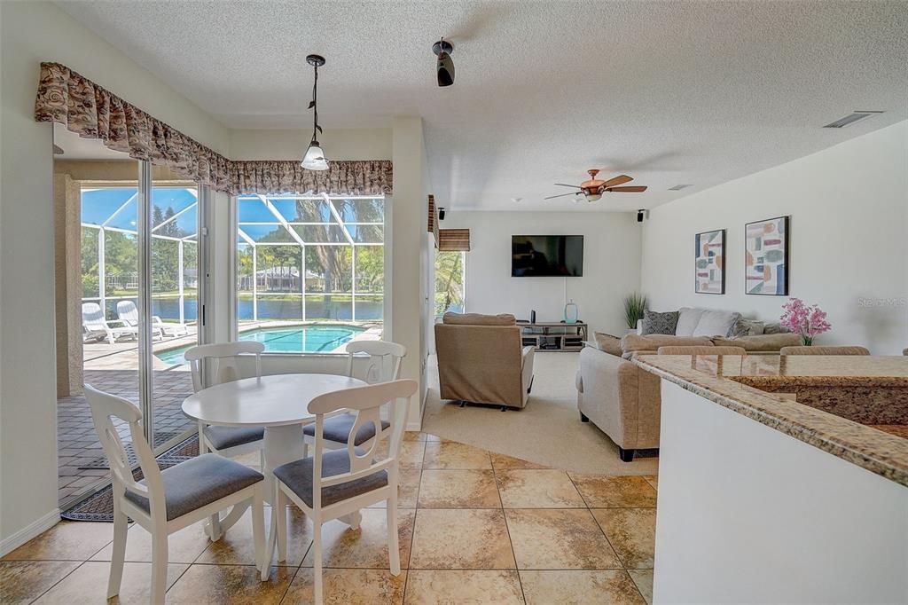 Beautiful kitchen flows seamlessly into casual dining area and spacious family room. Wonderful views of pond from most rooms.