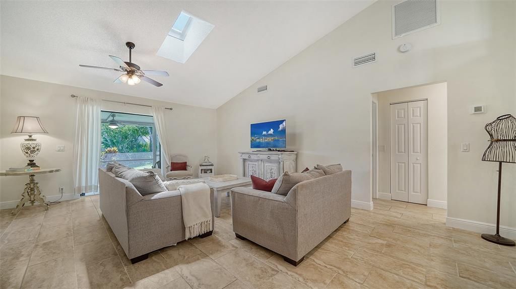 Great room with vaulted ceilings and skylights