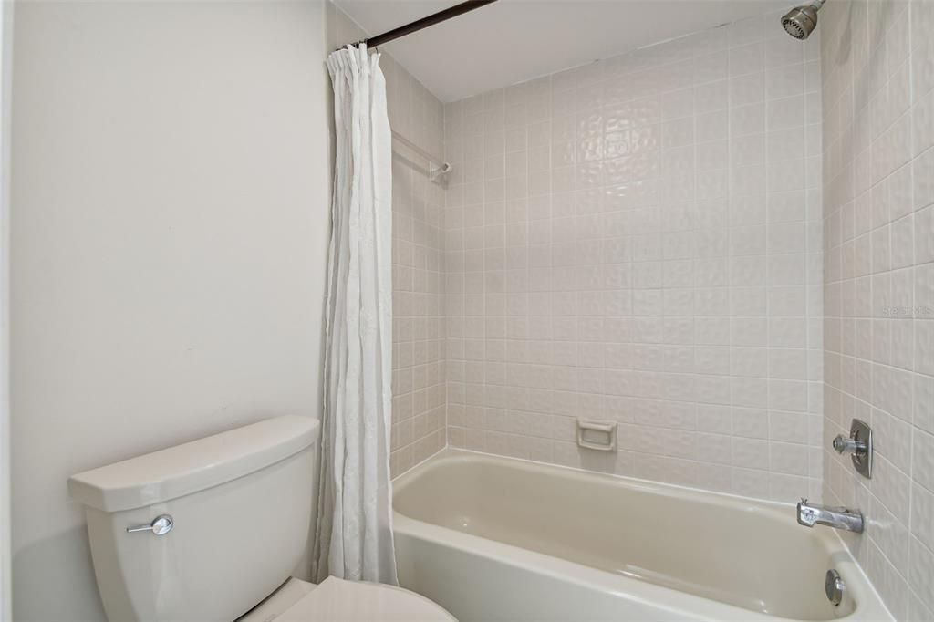 Secondary Bathroom - Tub with shower.