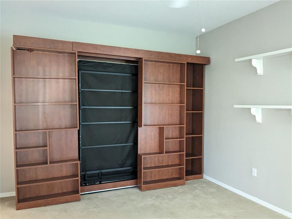 Murphy bed in Den, closes to a book shelf Possible 3rd bedroom