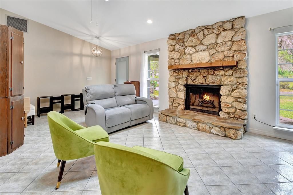 Great room with wood-burning stone fireplace