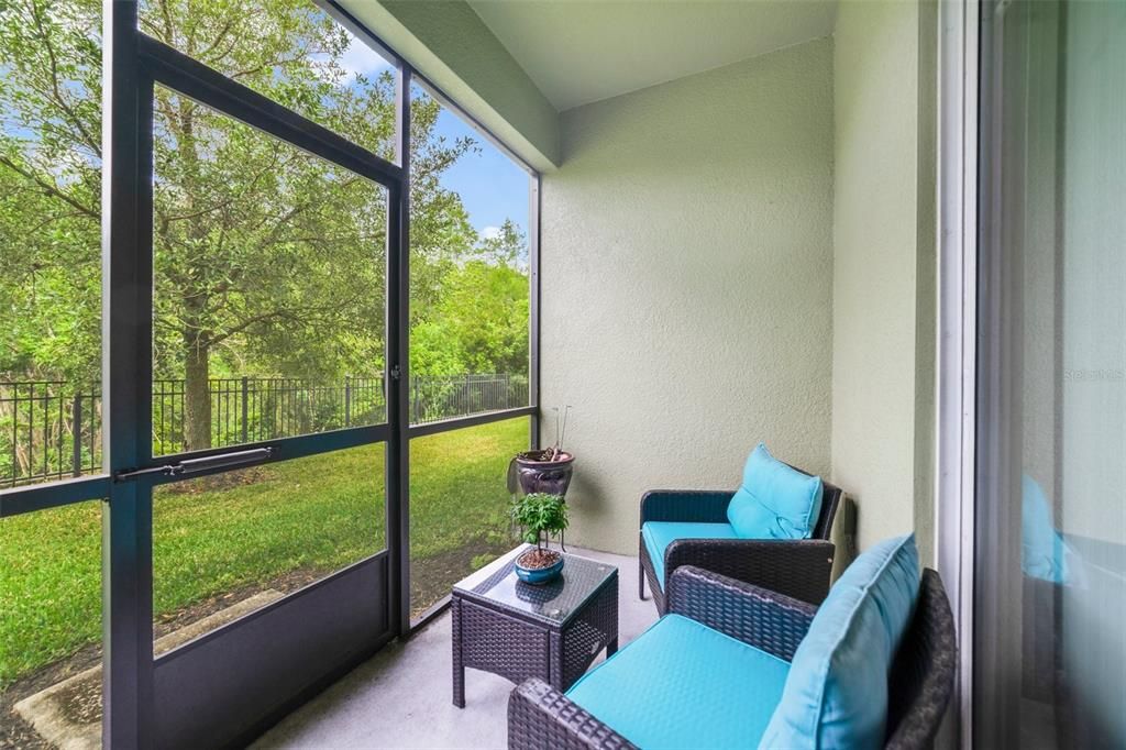 The SCREENED LANAI is the perfect space to start the day or relax and unwind in the evening, the wooded view provides a tranquil backdrop to this ideal townhome!