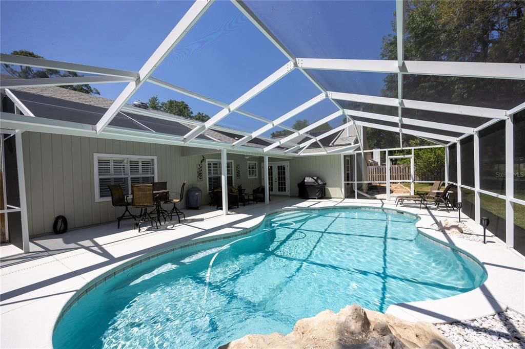 Screened salt water pool with covered area