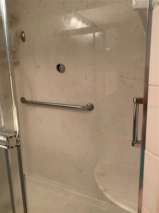 Master step in shower with seat
